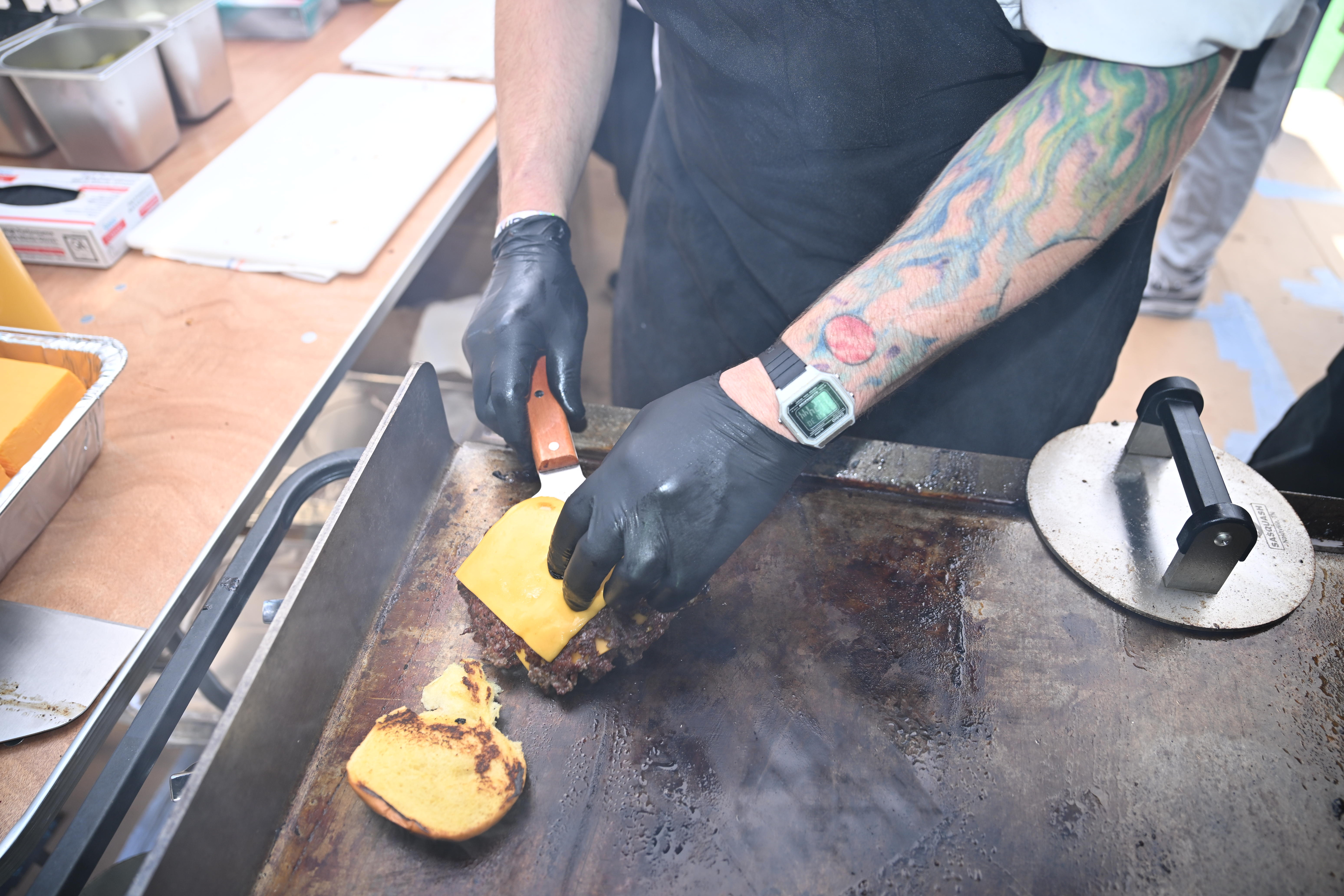 Burgers are prepared at Kel's Burger Fest.