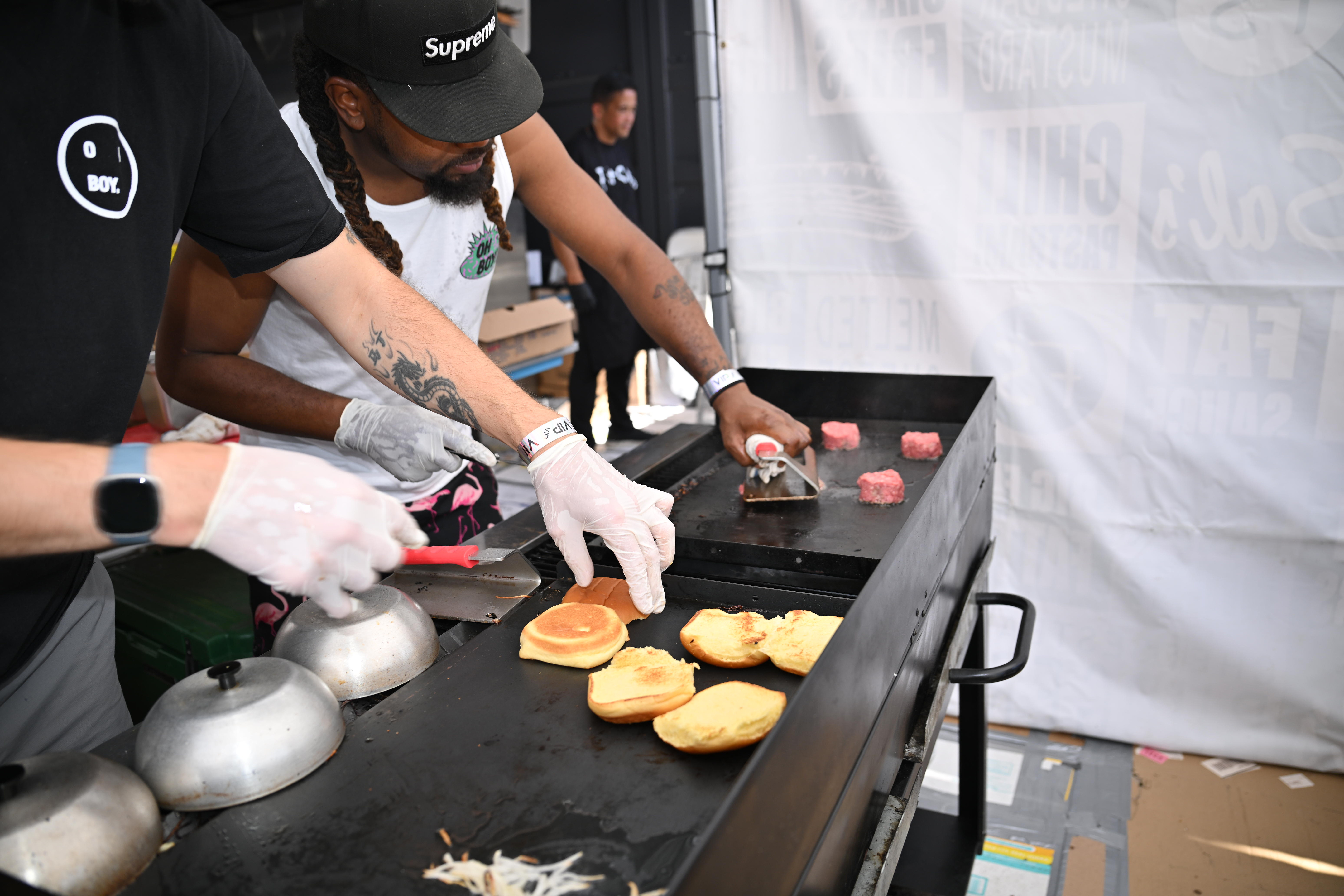 Burgers are prepared at Kel's Burger Fest.