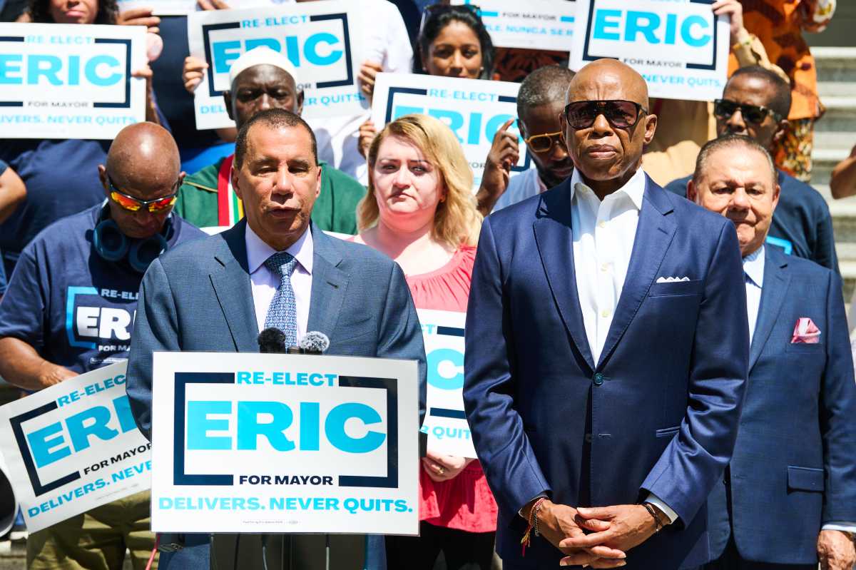 two men speaking at political rally, paterson supporting Eric Adams for mayor