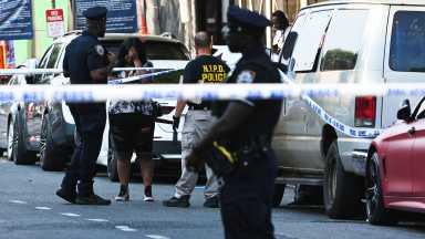 woman in tears at scene of mass shooting in Brooklyn