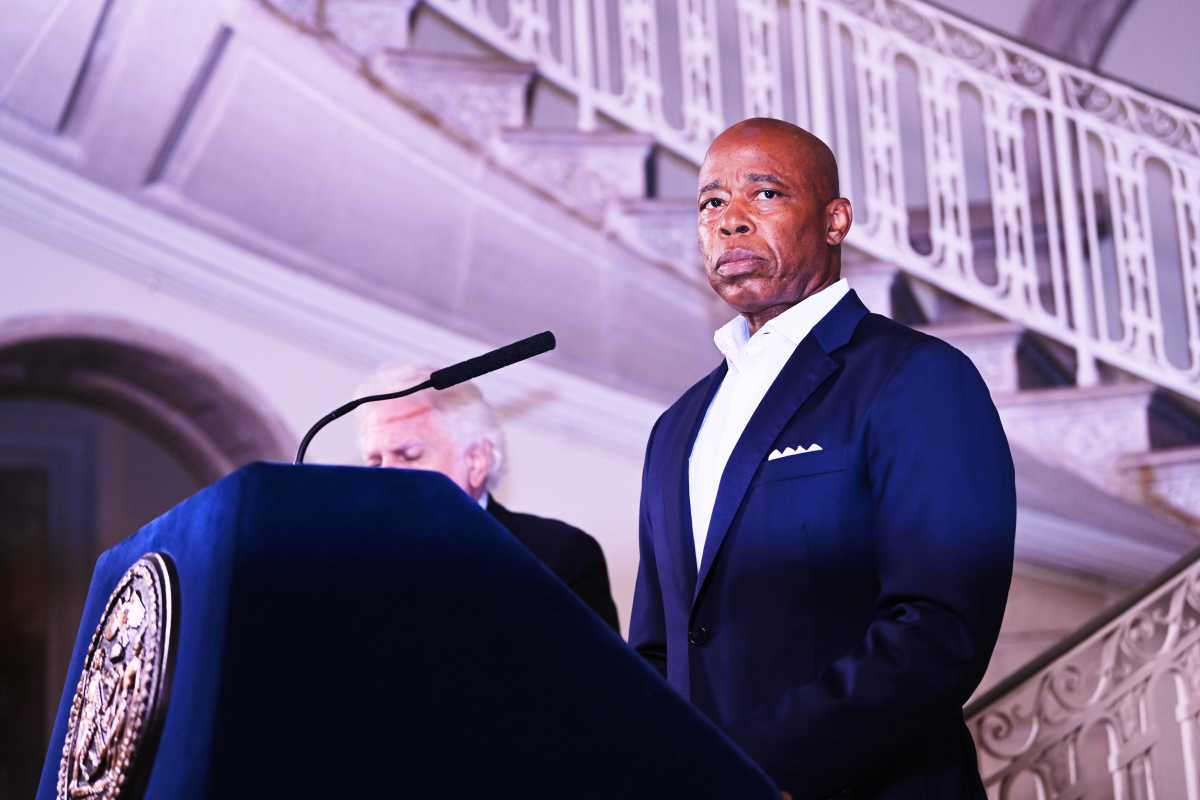 Mayor Eric Adams speaking at podium