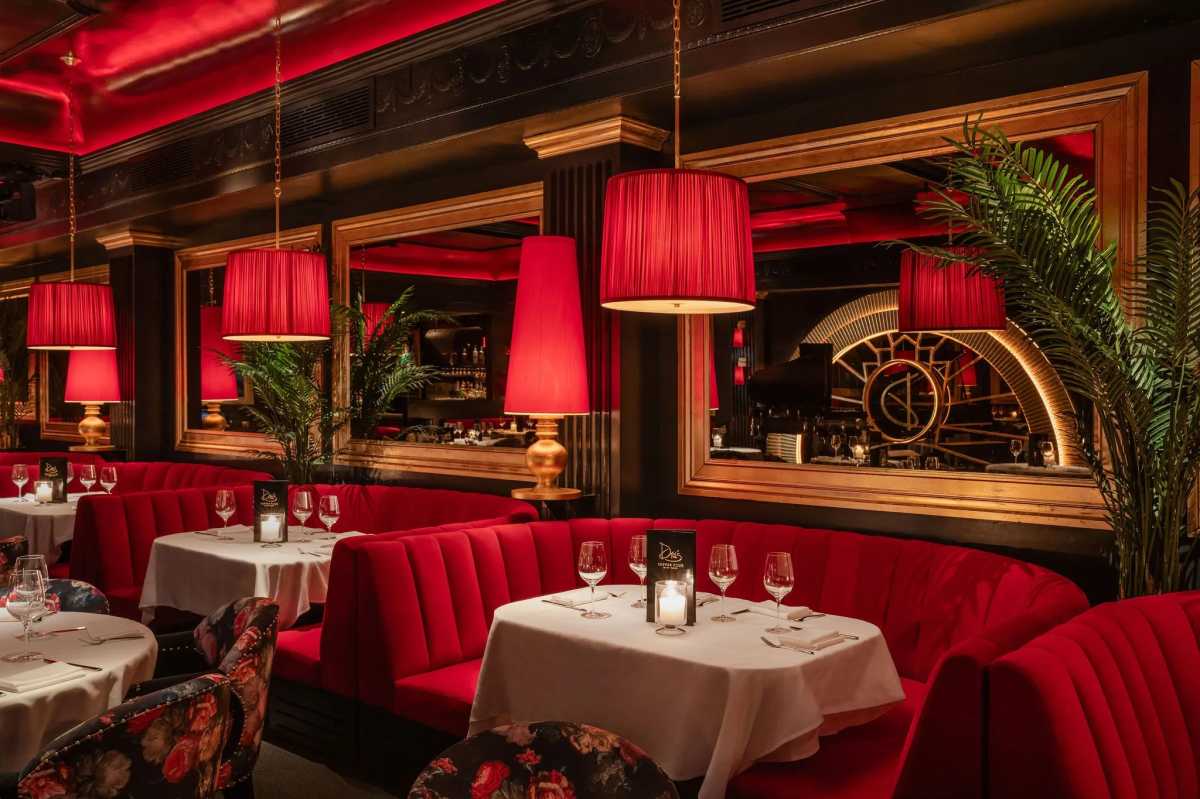 Interior with tables and red motif at Drai's Supper Club in the Meatpacking District