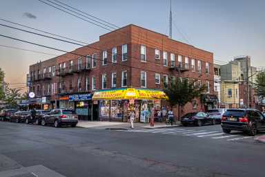 36th Avenue, Long Island City, Queens, New York, USA - August 18th 2023: Small supermarket and deli at a street corner in the early evening bodega