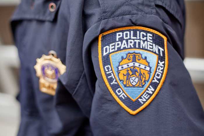 The narcotics detective was shot in the leg and arm after coming across a carjacking in progress