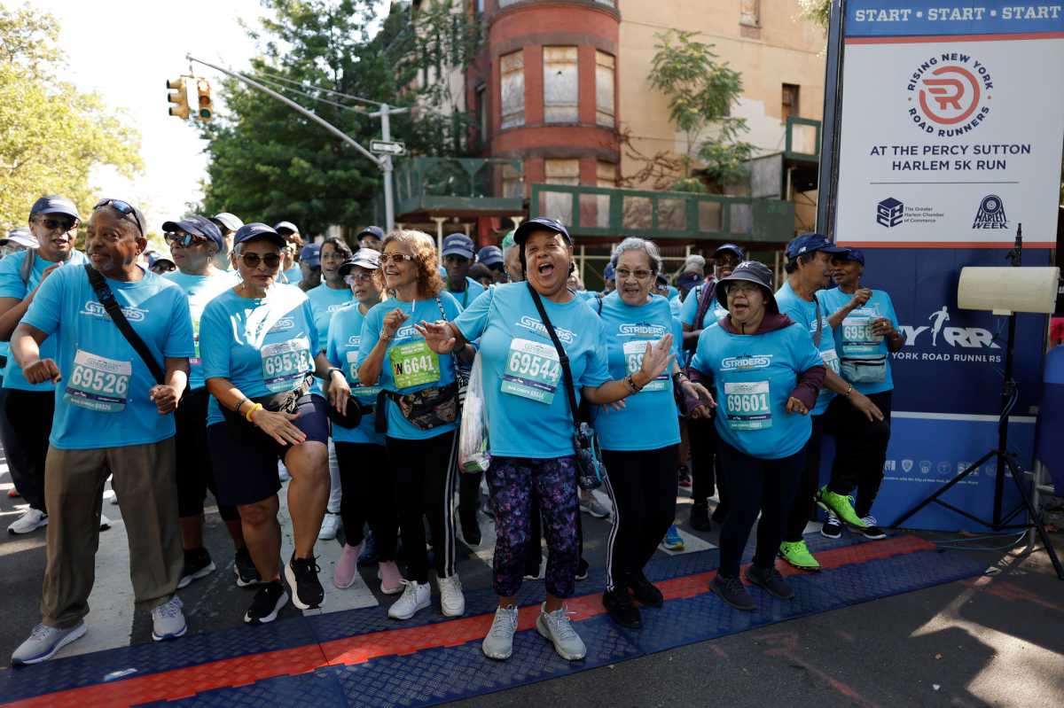 The NYRR Striders participate in the 2025 Percy Sutton Harlem 5K in Harlem, New York City. (Photo by Adam Hunger for NYRR)