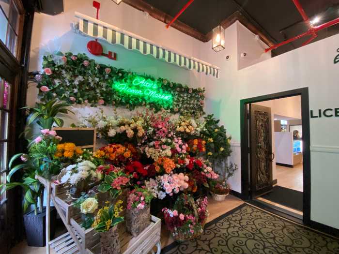 The family-run cannabis shop features floral arrangements and other welcoming touches near the security check-in area