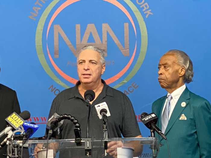Nunzio Quinto, a construction worker hospitalized with Legionnaires’ disease, speaks alongside Rev. Al Sharpton during a press conference at the National Action Network headquarters in Harlem, Wednesday.