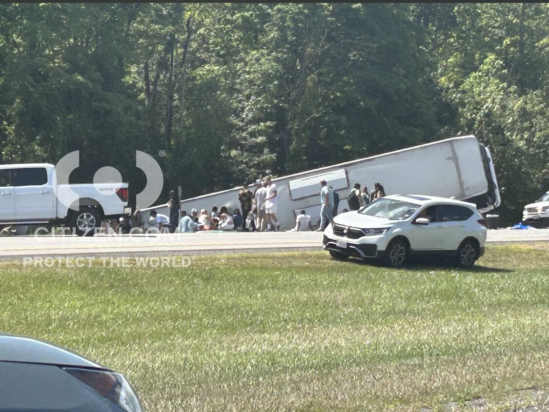 The overturned tour bus along Interstate 90 in Pembroke, N.Y., on Friday after crashing while bound for New York City.