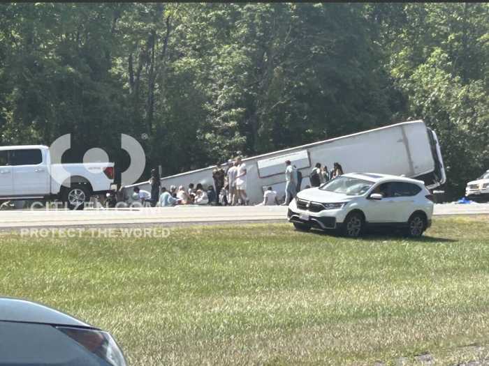The overturned tour bus along Interstate 90 in Pembroke, N.Y., on Friday after crashing while bound for New York City.