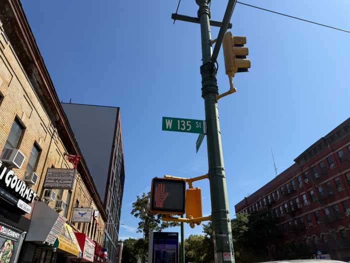 135th street street sign in Harlem which willbe renamed for harry belafonte