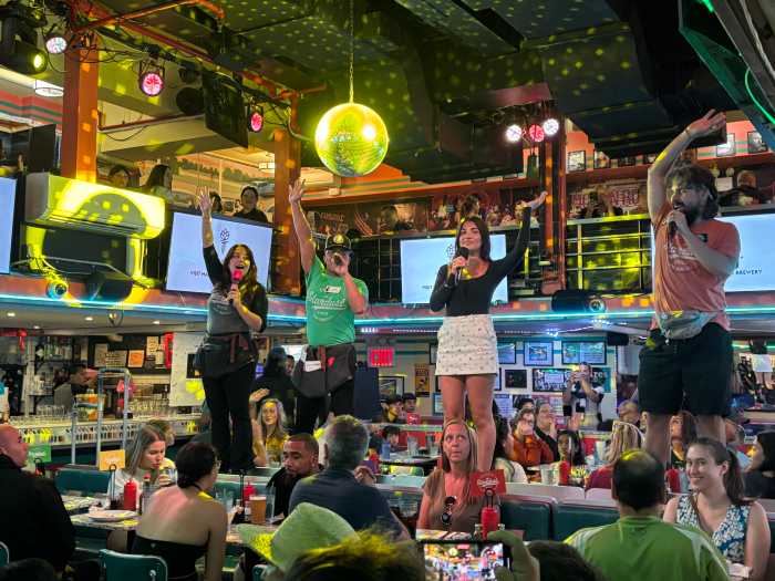 teens sing at Ellen's Stardust Diner.