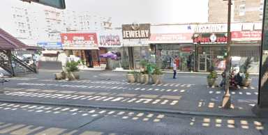 A view of Westchester Avenue in the Soundview neighborhood of the Bronx, where police say a masked gunman fatally shot a man outside ExoticWorld Smoke Shop on Aug. 7