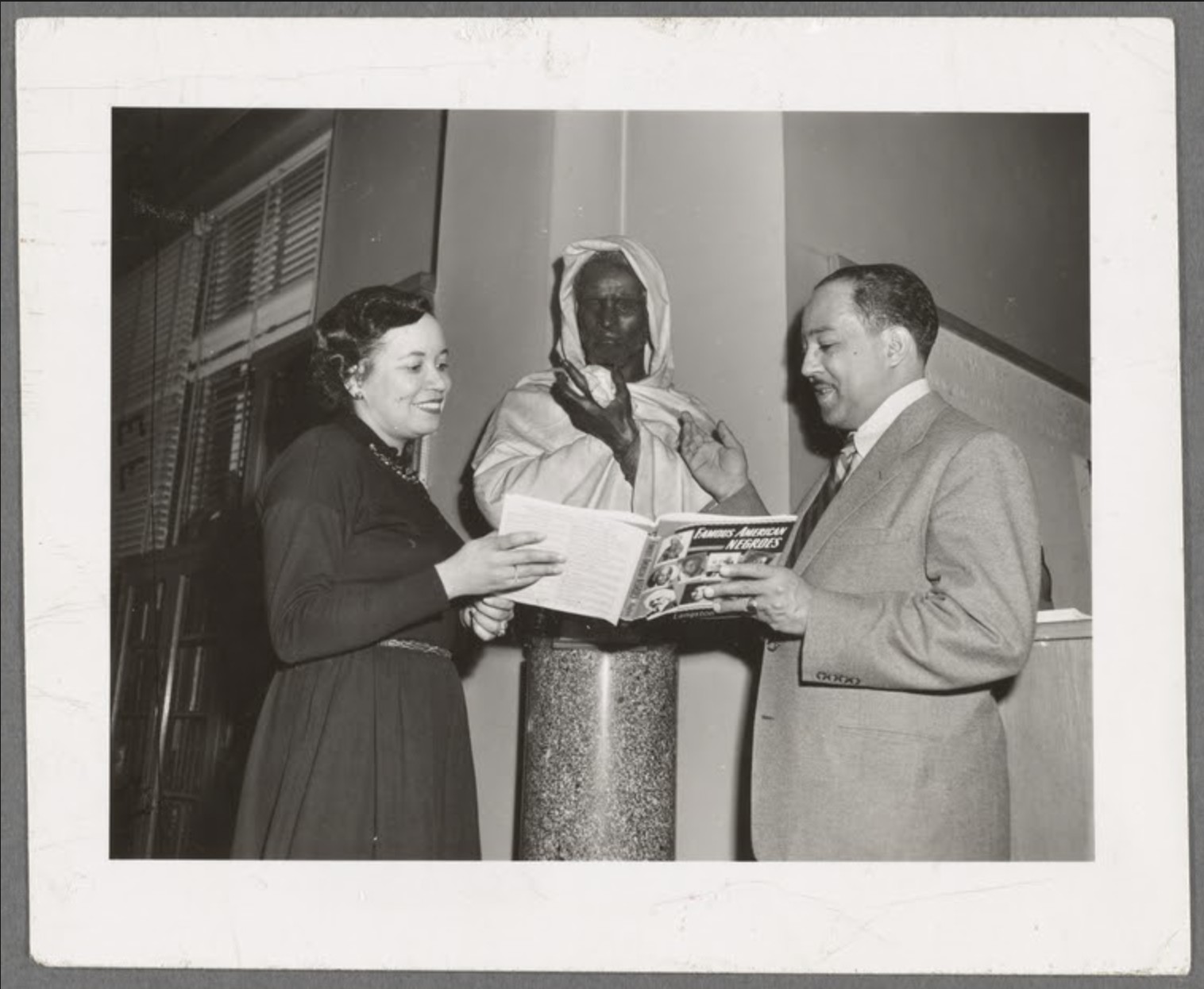 Jean Blackwell Hutson, Curator of the Schomburg Collection, and writer Langston Hughes at the Schomburg Collection in Harlem. 1954.