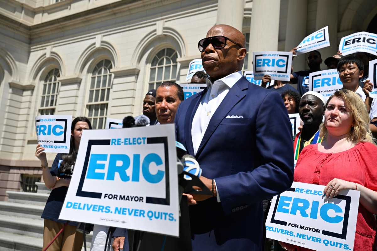 NYC Mayor's Race: Former Gov. Paterson backs Adams, drops bid for Mamdani rivals to coalesce 2 man in sunglasses and suit talking at rally for Eric Adams