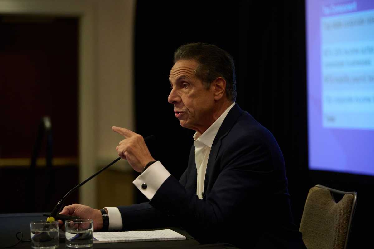 NYC Mayor's Race: Mamdani accuses Cuomo of 'conspiring' with Trump in wake of reported call 3 man in suit pointing at microphone andrew cuomo