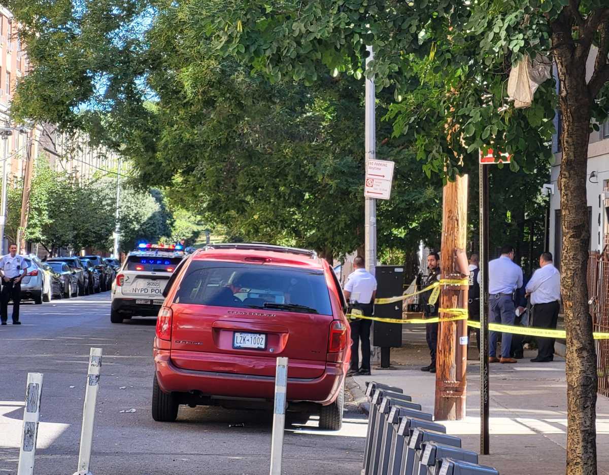 Police walk through area near shooting rampage scene in the Bronx