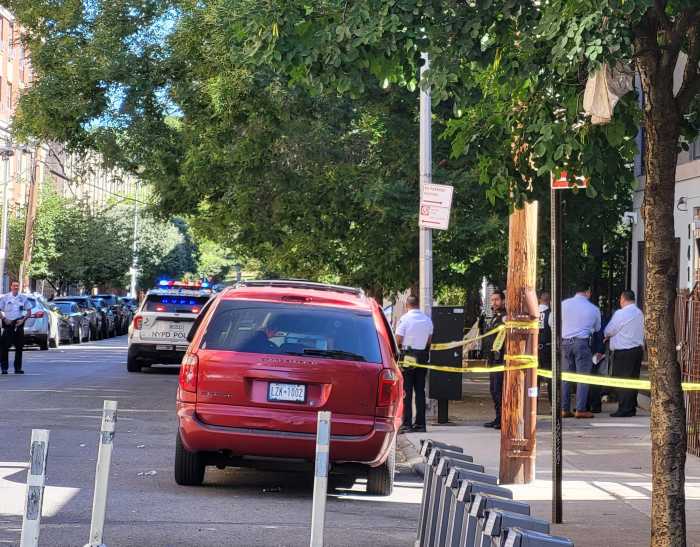 Police walk through area near shooting rampage scene in the Bronx