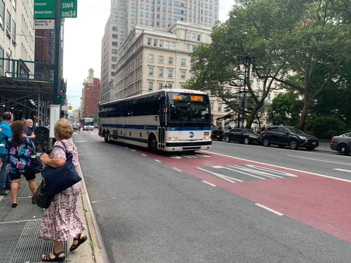 a bus riding in a city street