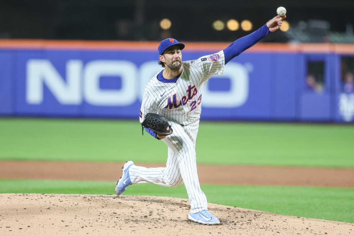 David Peterson Mets Braves: Man in white uniform throws baseball off mound