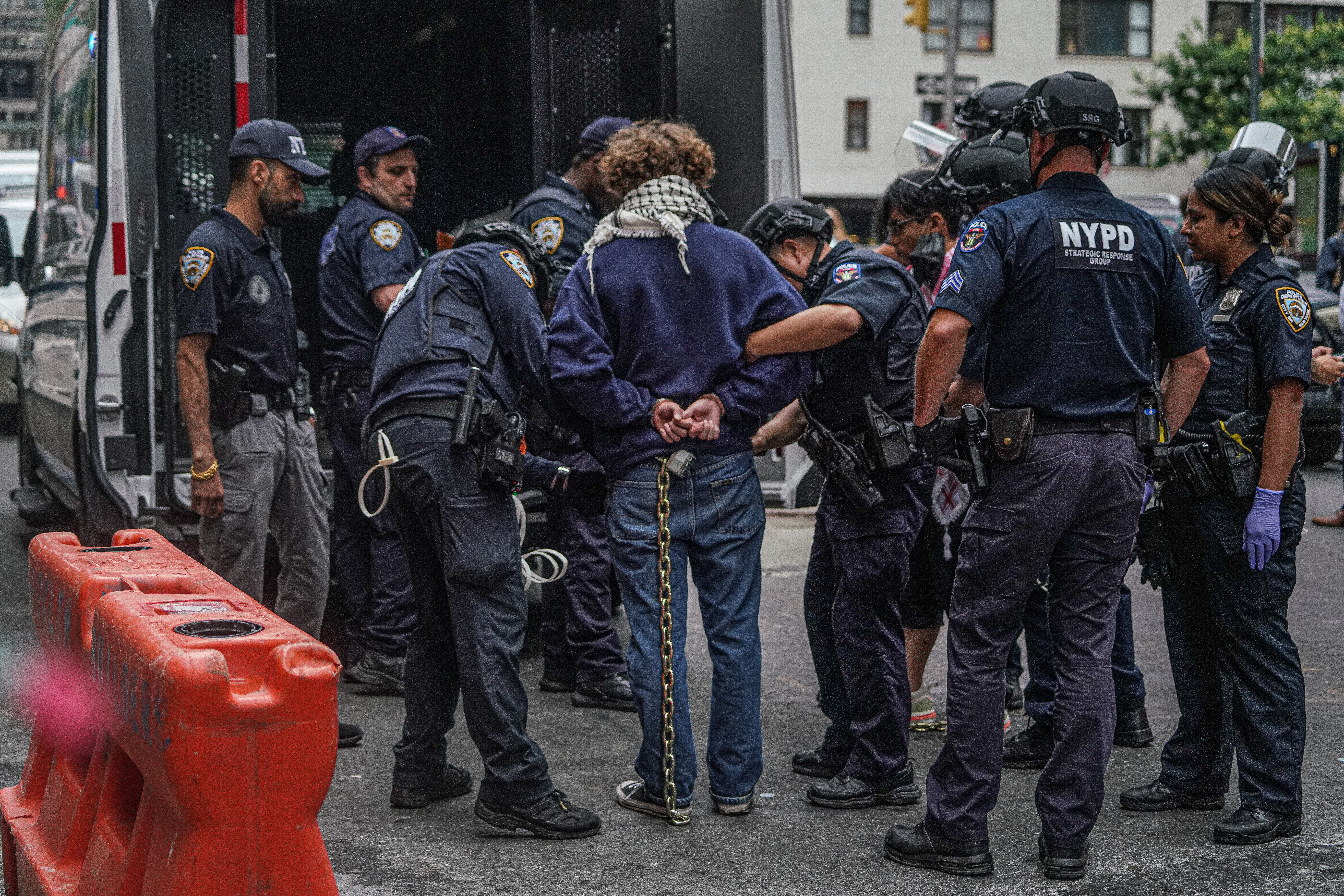 NYPD arrests a protester in Midtown.