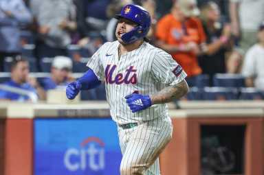 Mets player Francisco Alvarez celebrates after hitting a home run