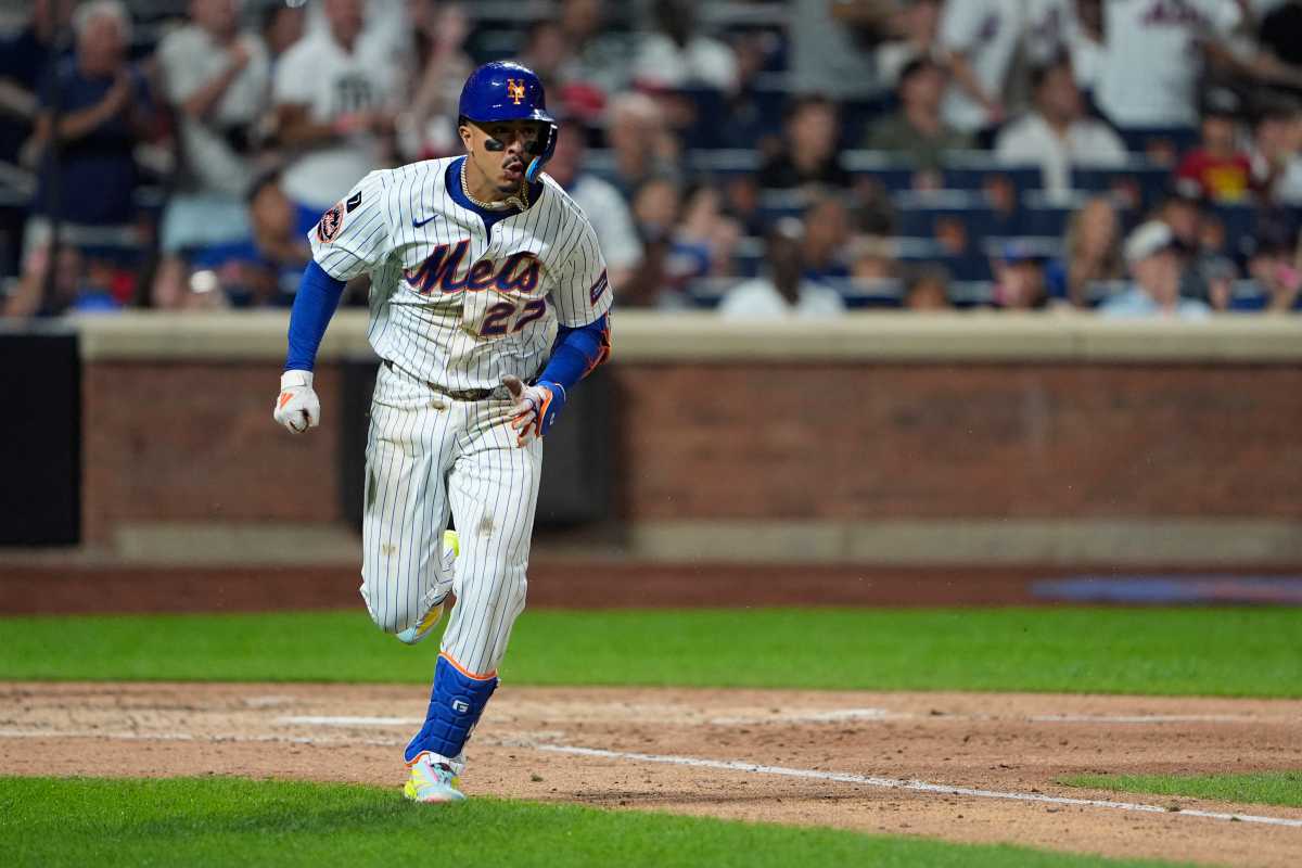 Mark Vientos double Mets Phillies: Man in wihte uniform runs to first base after hitting ball