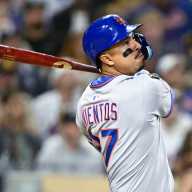 Mets trade rumors: Latest on Mark Vientos 11 Mark Vientos Mets: Man in grey uniform wings baseball bat and watches ball