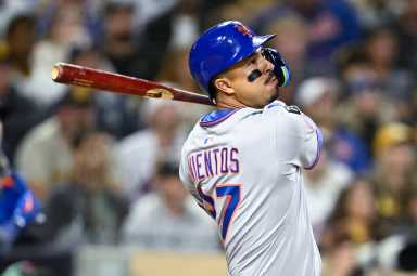 Mark Vientos Mets: Man in grey uniform wings baseball bat and watches ball