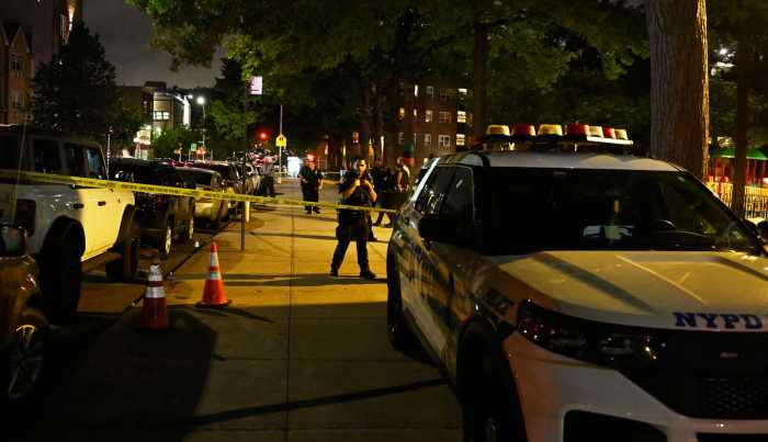 police at night with car in front at scene of deadly shooting