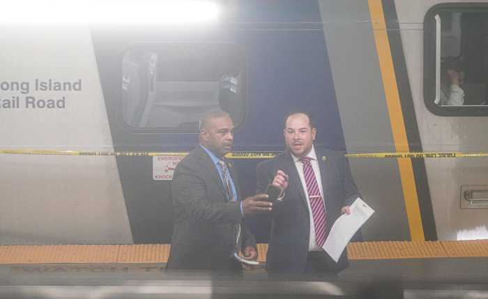 Police officers investigate Penn Station police shooting