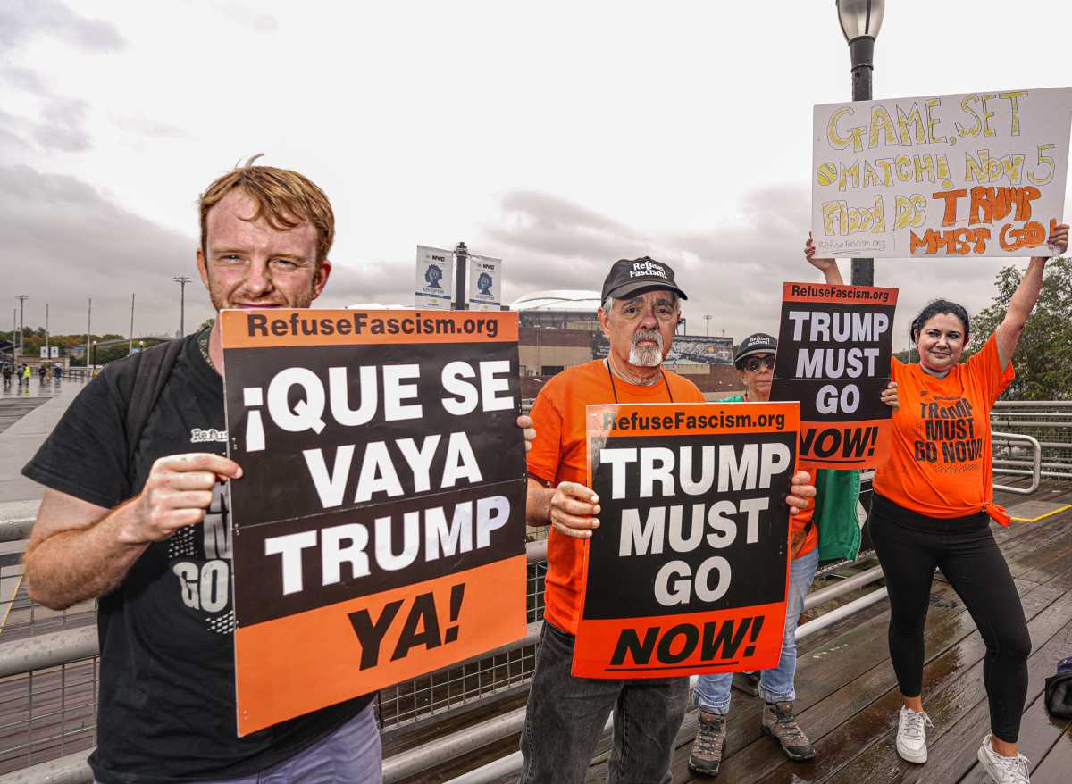 Protesters outside US Open demand fans jeer Trump during president's visit to men's final 4
