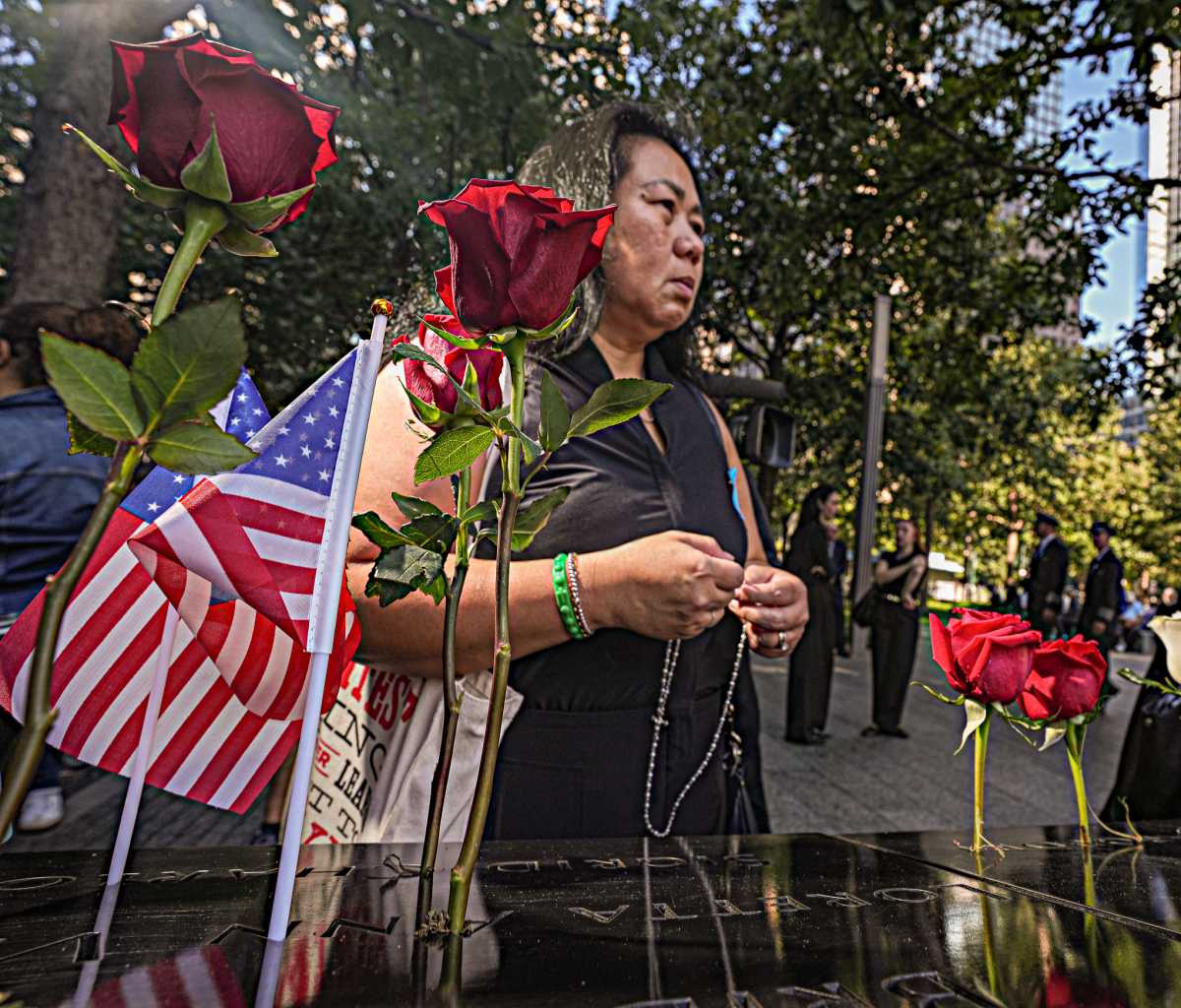 Family member of 9/11 victim grieves at memorial for World Trade Center victims