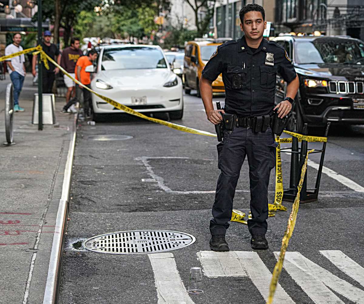 Police at crime scene near Mexican Day Parade in Midtown