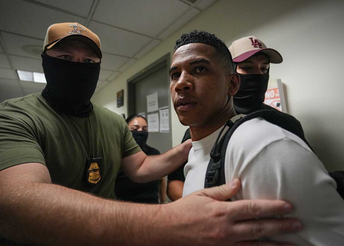 ICE agents in masks detain immigrant in court