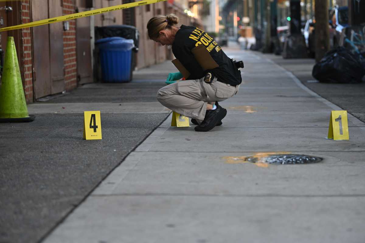 The NYPD Crime Scene Unit processes a fatal double stabbing at Ridgewood Avenue and Cresent Street.