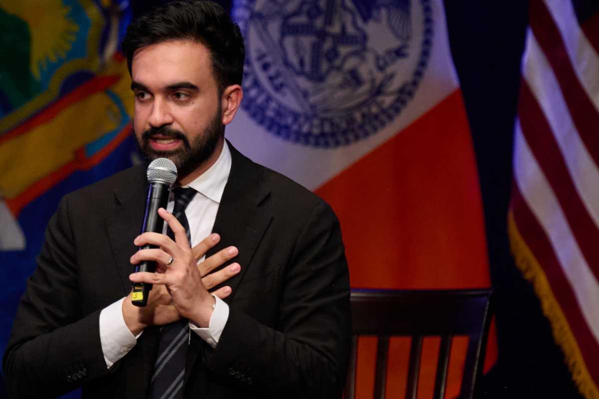 zohran mamdani man with beard speaking into microphone