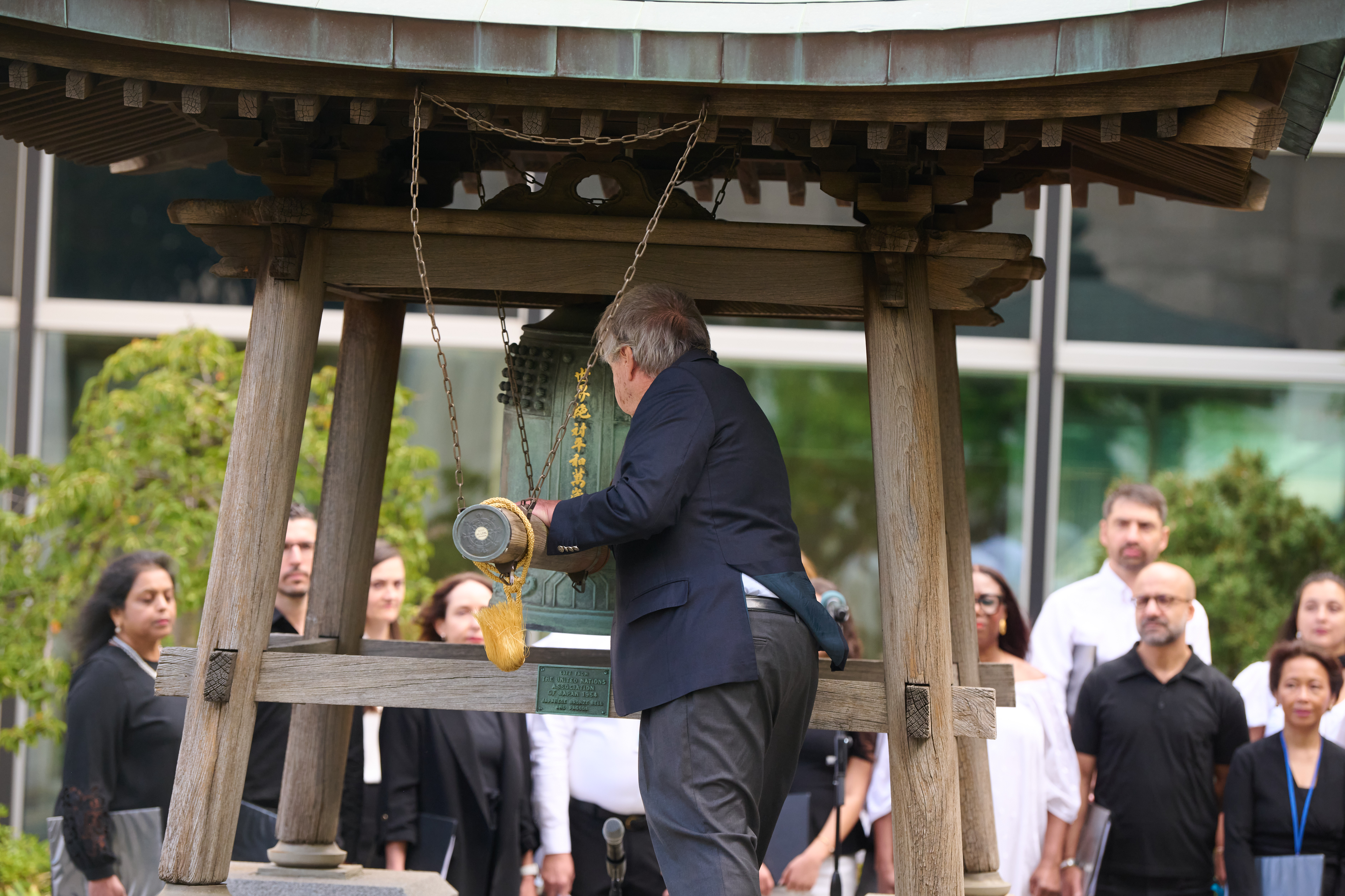 UN Secretary-General António Guterres rings the bell.