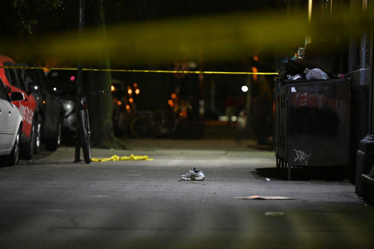 Police from the 70th Precinct investigate a fatal shooting at 85 Crooke Avenue on Sept 17..