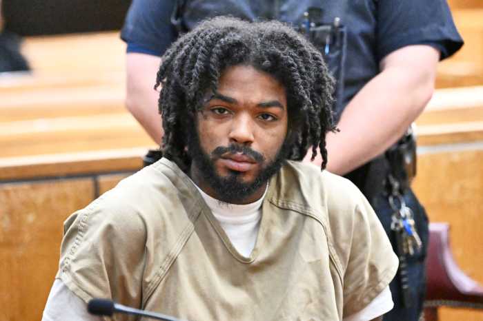 Suspect seated while handcuffed for Lower East Side naked rampage in which he attacked cops