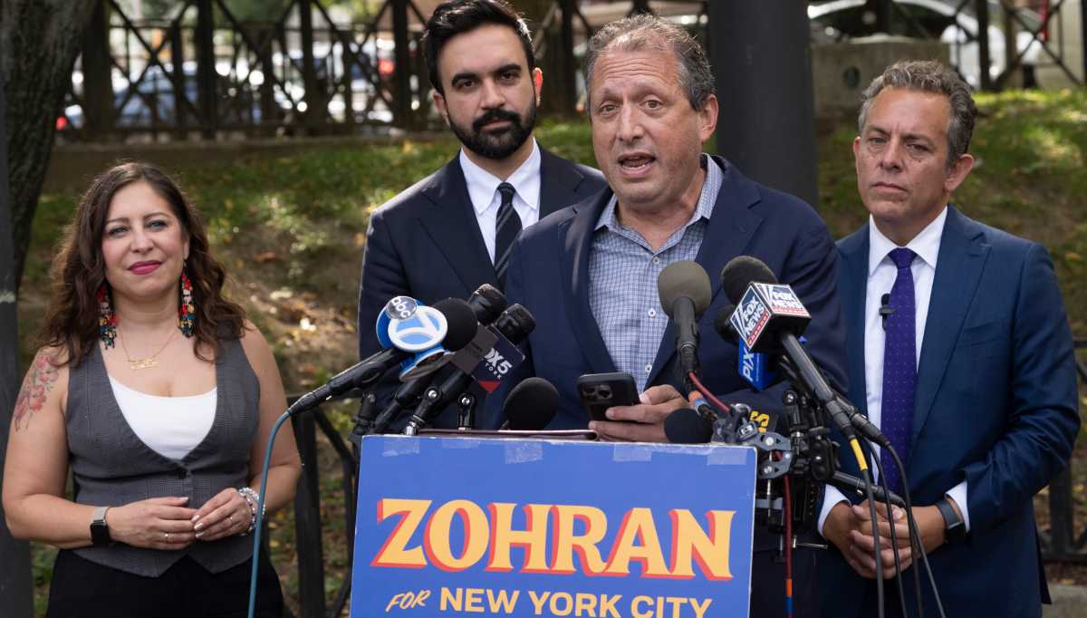 Comptroller Brad Lander speaks at a press conference in Queens on September 25, alongside mayoral nominee Zohran Mamdani and Assemblymembers Tony Simone and Jessica González-Rojas