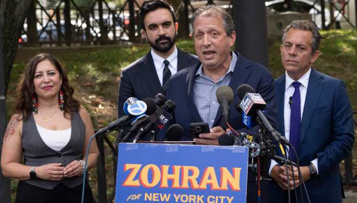 Comptroller Brad Lander speaks at a press conference in Queens on September 25, alongside mayoral nominee Zohran Mamdani and Assemblymembers Tony Simone and Jessica González-Rojas