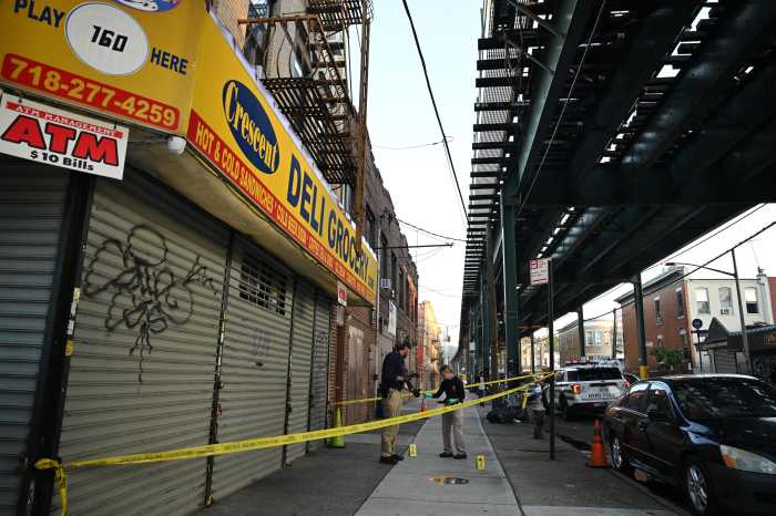 Police cordon off Ridgewood Avenue in Brooklyn’s Cypress Hills on Friday following a double stabbing that killed a 30-year-old man and injured another.