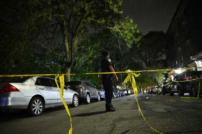 police officer near crime scene tape in Bronx