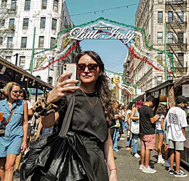 A woman poses at the Feast of San Gennaro