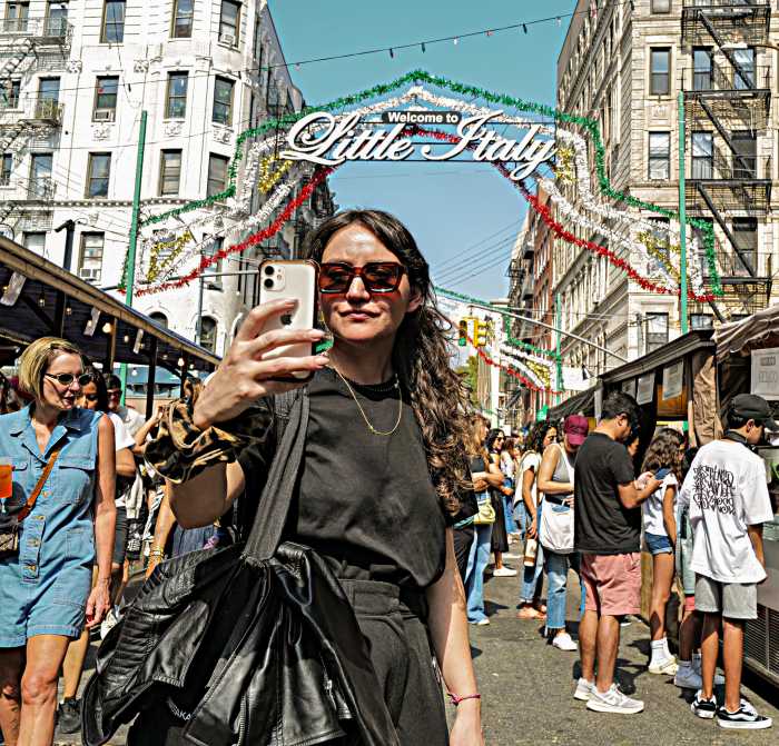 A woman poses at the Feast of San Gennaro