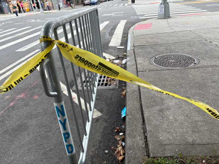 A stretch of police tape still marked the scene on Buffalo Avenue in Crown Heights on Thursday, a day after a shooting left a 23-year-old man wounded.