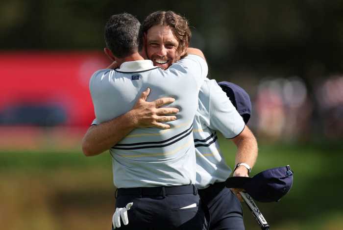 Rory McIrloy Tommy Fleetwood embrace Team Europe Ryder Cup Bethpage Black