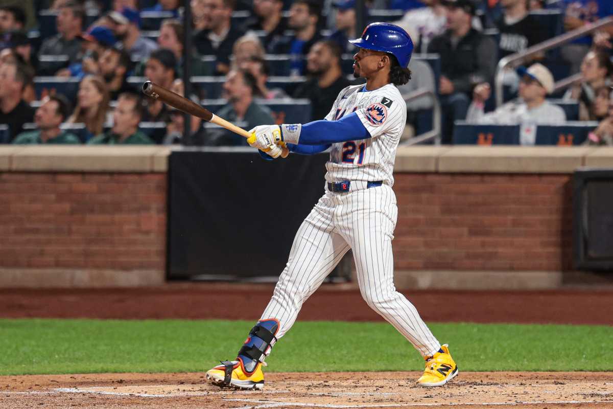 Francisco Lindor Mets home run Padres: Man in white baseball uniform watches ball as it leaves stadium