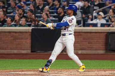 Francisco Lindor Mets home run Padres: Man in white baseball uniform watches ball as it leaves stadium
