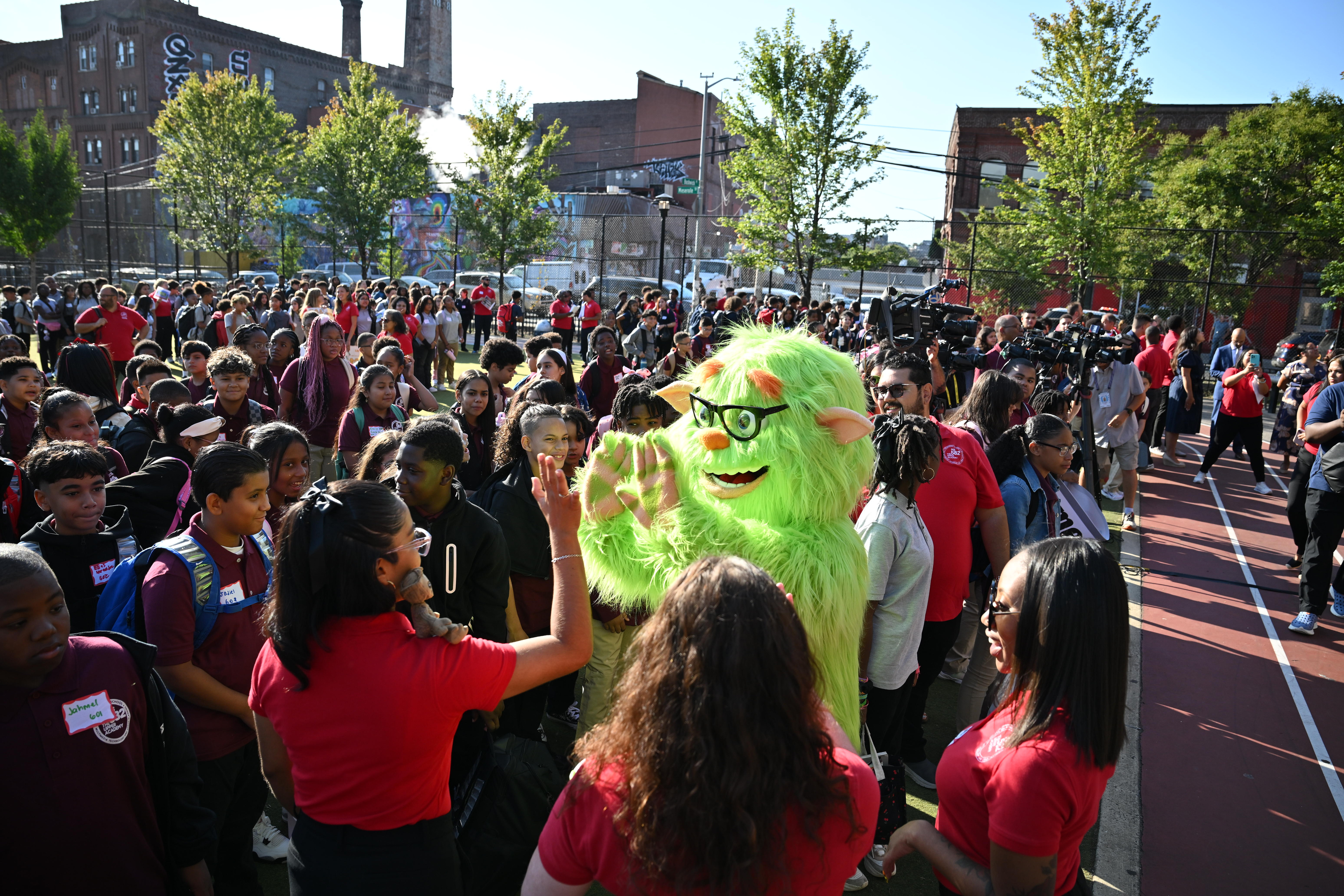 Frankie Focus greets  students.